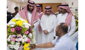 Crown prince visits injured security men who thwarted plan to target Grand Mosque