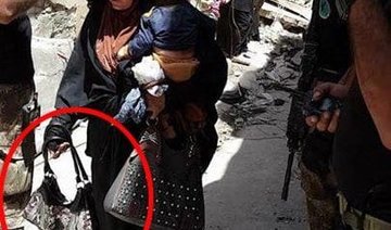 Chilling image captures woman suicide bomber clutching child, moments before death
