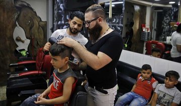 Syrian barber creates portraits on canvas — clients’ heads