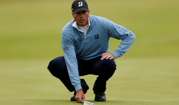 Kuchar happy to put feet up and watch rivals scrap