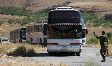 Fighters, refugees leave Lebanon enclave for Syria