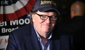 Michael Moore leads audience of Broadway play to Trump Tower