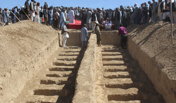 Afghan police discover mass graves after village attack