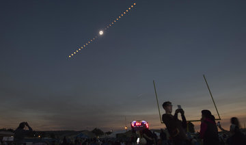 Mother of all photobombs? Twitter erupts as space station sneaks into snap of the eclipse