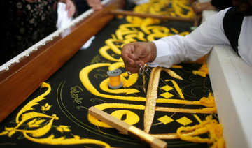 Saudi factory stitches gold-laced cover for Islam’s holiest site