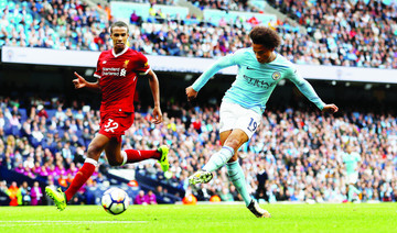 City routs Reds, Arsenal eases pressure on Wenger