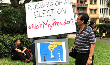 Singaporeans protest against uncontested presidential election