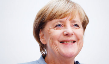 Merkel strikes reserved tone on Macron’s Europe plans