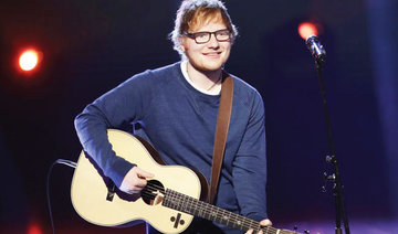 UK singer Ed Sheeran tells fans of bike accident, arm injury