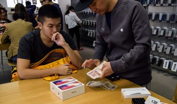 Apple’s iPhone X hits Asia stores as profits soar