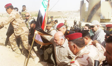Al-Abadi raises flag in border area taken from Daesh