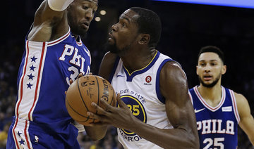Durant leads defending NBA champions Warriors after missing a game