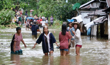 3 dead, 77,000 flee as storm pounds Philippines