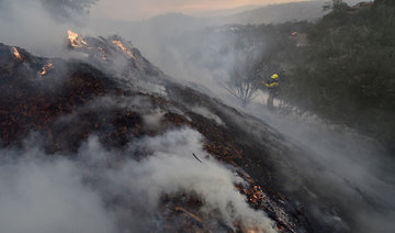 Flames threaten rich California enclave; residents flee