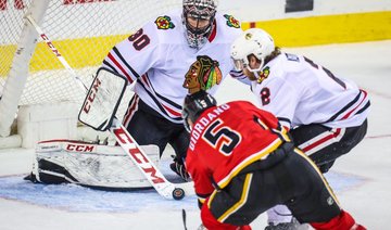 Giordano scores in OT to lift Flames over Blackhawks