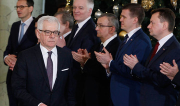 Polish PM sacks key ministers in moves to mend EU ties