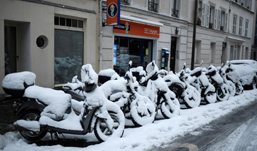 Heavy snow paralyzes Paris causing misery for commuters