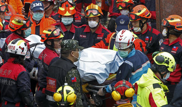 Workers try to shore up tilted buildings after Taiwan quake