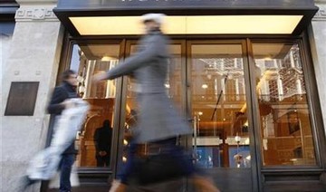 Britain’s Burberry pairs up with Farfetch in online push