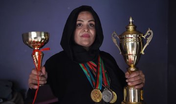 Afghan women power-lifters flex their muscles