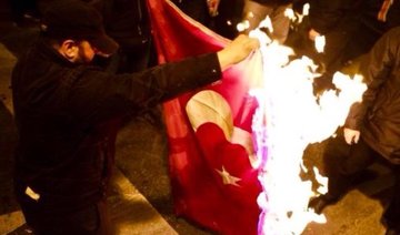 Turkey wants Greece to arrest protesters for burning flag