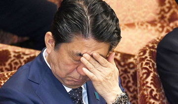 Japan PM Abe denies involvement by him, wife in discount land sale