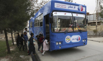 PHOTOS: Blue bus of Kabul brings joys of reading to Afghan children