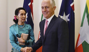 Myanmar’s Suu Kyi welcomed to Australia amid protests