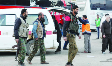 Opposition fighters begin leaving Eastern Ghouta