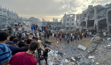 Palestinians search for casualties at the site of Israeli strikes on houses in Gaza Strip, October 31, 2023. (REUTERS)
