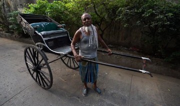 Rickshaw pullers fade from India’s streets