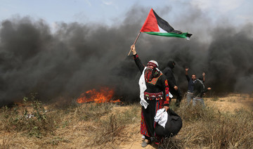 In Gaza, women protest among the burning tires and smoke