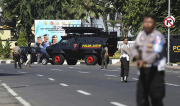 2 militants on motorcycle blow themselves up at Indonesian police HQ, wounding 10 people