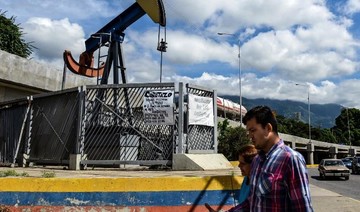 Iran and Venezuela weighing on oil market, energy watchdog says