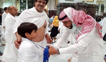 Badges providing basic Two Holy Mosques information given to children, the elderly and non-Arabic speakers