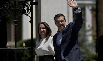 Greece ‘turning a page’ as eurozone declares crisis over