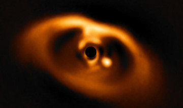 Astronomers report first image of baby planet being formed