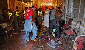 Pakistan election rally suicide bomb toll climbs to 20