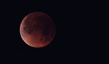 Red planet and ‘blood moon’ pair up to dazzle skygazers