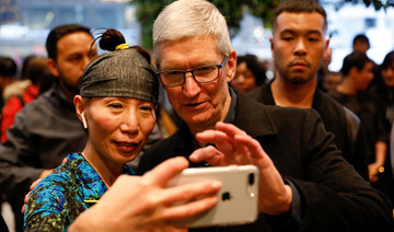 Apple hits $1 trillion mark, turns Nasdaq positive