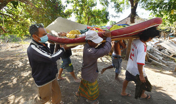 Indonesian rescuers struggle to reach cut-off villages after deadly quake