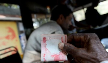 Indian rupee hits record low of 70 to the dollar