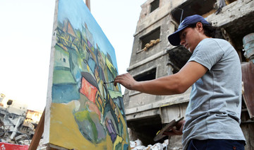 In Syria’s Yarmuk, artists paint amid the ruins