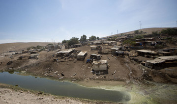 Sewage pool rings West Bank village awaiting demolition