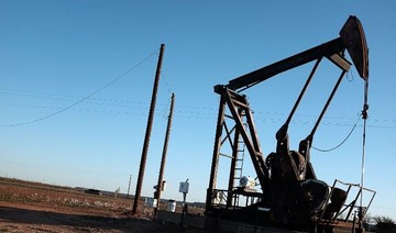 Oil prices edge up, but set for weekly loss on inventory build, US-China trade row