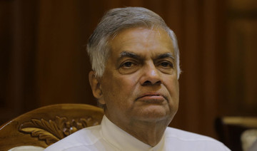 Sri Lankan rivals tempt defectors to swing crisis