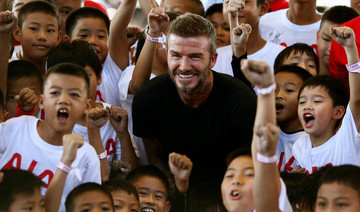 Beckham adds star power to Thai soccer clinic