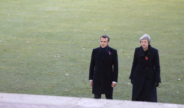 Theresa May marks Armistice centenary in Belgium, France