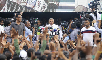 Punch-up in Sri Lankan parliament as thousands rally