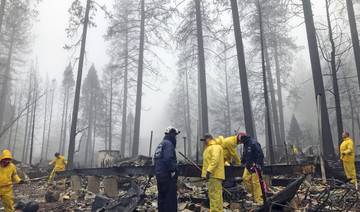 Rain helps douse California fire but slows search crews
